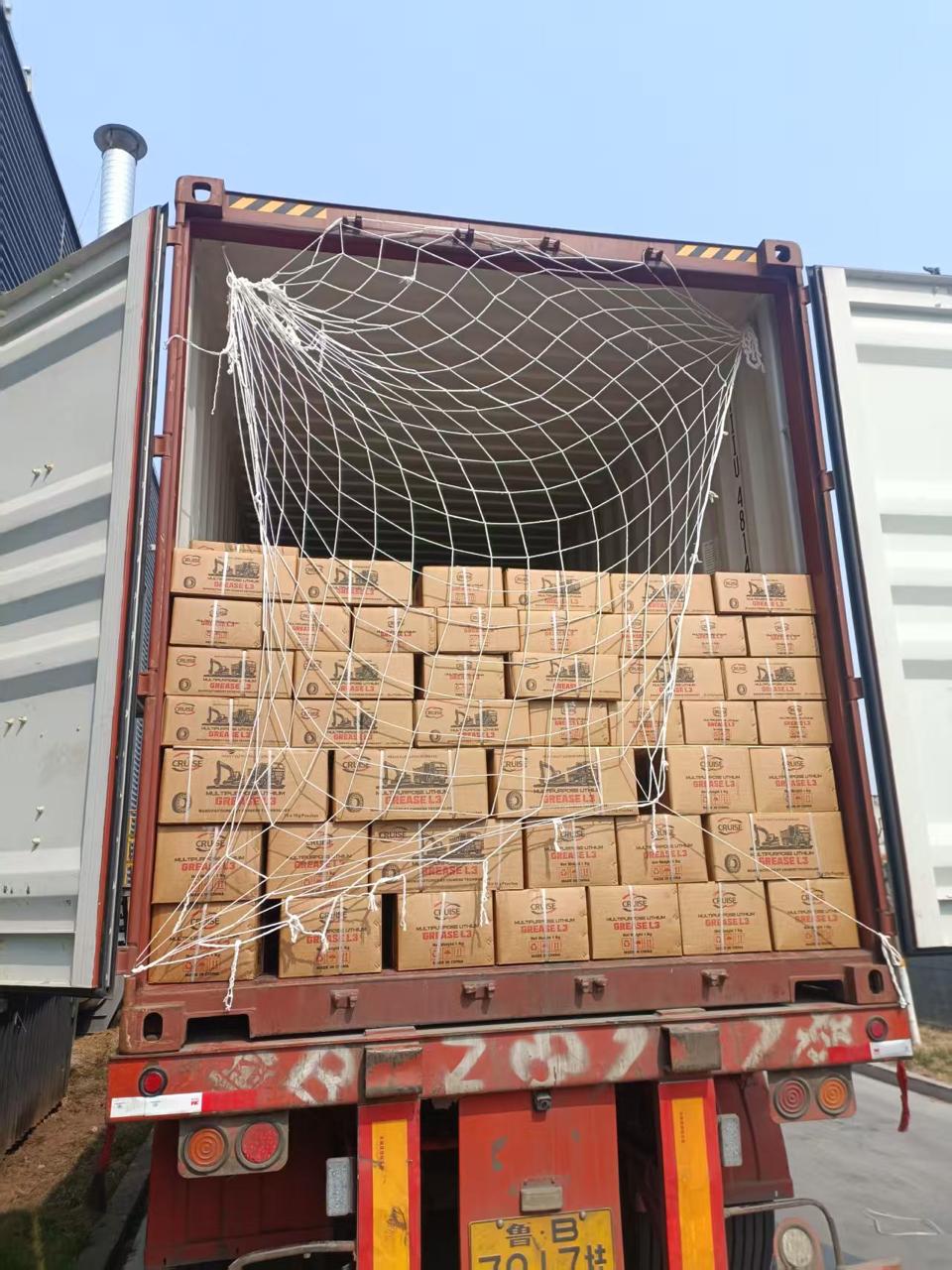 Cruise Grease L3 grease cartons netted inside an export container