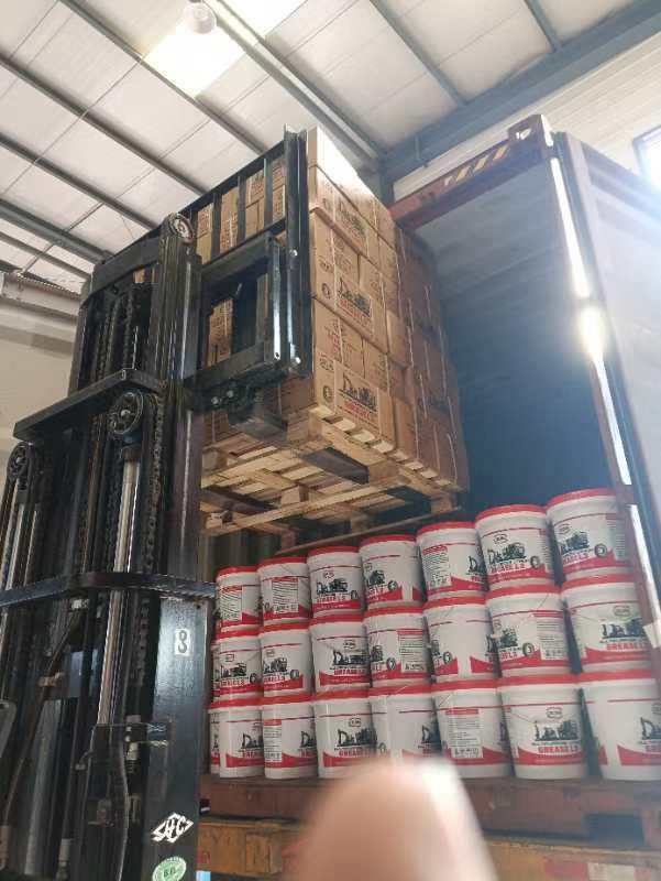 Cruise Grease pallets loaded by forklift into an export container